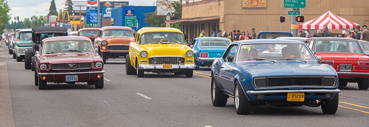 Classic cars cruising down Main Street during Function 4 Junction event in Junction City Oregon
